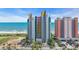 Bright, colorful condo building at the beach with ocean views and palm trees at 1700 N Ocean Blvd. # 651, Myrtle Beach, SC 29577