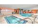 Indoor swimming pool with a waterfall feature and blue tiles at 1700 N Ocean Blvd. # 651, Myrtle Beach, SC 29577
