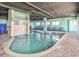 Large indoor pool with waterfall feature, seating area, and abundant natural light at 1700 N Ocean Blvd. # 651, Myrtle Beach, SC 29577