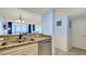 The kitchen sink and dishwasher are surrounded by granite countertops and bright white cabinetry at 1700 N Ocean Blvd. # 651, Myrtle Beach, SC 29577