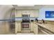 The kitchen features stainless steel appliances, granite countertops, and bright white cabinetry at 1700 N Ocean Blvd. # 651, Myrtle Beach, SC 29577