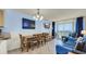 Comfortable living and dining area leading to a balcony with ocean views at 1700 N Ocean Blvd. # 651, Myrtle Beach, SC 29577