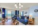 Relaxing living area with ocean views through sliding glass doors and comfortable blue sofas at 1700 N Ocean Blvd. # 651, Myrtle Beach, SC 29577