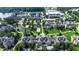 Aerial view of a neighborhood and buildings, trees, lawns, ponds, parking lots, and roads in a campus setting at 1836 Juniper Dr., Conway, SC 29527