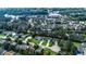 Overhead shot of a community featuring red brick buildings and ponds, interspersed with greenery and roads at 1836 Juniper Dr., Conway, SC 29527