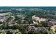 High aerial view of a residential community featuring mature trees, various building types and community parking at 1836 Juniper Dr., Conway, SC 29527