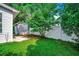 A fenced-in backyard includes a grassy lawn and mature trees, offering a private outdoor space at 1836 Juniper Dr., Conway, SC 29527