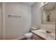 Neat bathroom featuring a classic vanity, commode and mirror with neutral finishes at 1836 Juniper Dr., Conway, SC 29527