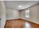 Cozy bedroom with wood-look flooring, natural light, and a neutral palette ready for personalization at 1836 Juniper Dr., Conway, SC 29527