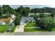 Aerial view of a single story home, with a driveway, fenced yard, and lush green trees surrounding the property at 1836 Juniper Dr., Conway, SC 29527