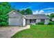 Charming single-story home with a gray exterior, garage, and well-maintained lawn at 1836 Juniper Dr., Conway, SC 29527