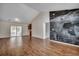Spacious living room with hardwood floors, high ceilings, natural light, and access to a screened-in porch at 1836 Juniper Dr., Conway, SC 29527