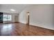 Spacious living room with wood floors, large window, and high vaulted ceilings for a bright and airy feel at 1836 Juniper Dr., Conway, SC 29527