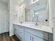Bathroom featuring double sinks with modern cabinetry and a large mirror at 189 Norris Ln, Loris, SC 29569