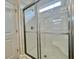 Modern bathroom shower with glass doors, sleek hardware and a built-in seat at 189 Norris Ln, Loris, SC 29569
