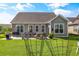 Expansive backyard features a patio with an outdoor dining set and well-maintained lawn at 1941 La Playa Dr., Myrtle Beach, SC 29588