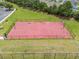 Community basketball court with well-maintained surface, hoops, and fencing, perfect for sports enthusiasts at 1941 La Playa Dr., Myrtle Beach, SC 29588
