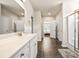 Bright bathroom featuring a white vanity with marble countertop and tile floors at 1941 La Playa Dr., Myrtle Beach, SC 29588