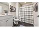 Clean and functional bathroom with a vanity, toilet, and shower with a curtain at 1941 La Playa Dr., Myrtle Beach, SC 29588