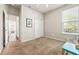 Bright bedroom featuring carpet floors, a closet, and ample natural light with a glimpse into adjacent rooms at 1941 La Playa Dr., Myrtle Beach, SC 29588