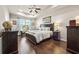 Spacious main bedroom with tray ceiling, dark wood furniture, and ample natural light at 1941 La Playa Dr., Myrtle Beach, SC 29588