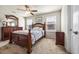 Well-lit bedroom with a cherry wood bed set and cozy carpet at 1941 La Playa Dr., Myrtle Beach, SC 29588