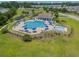 Community pool area featuring a large pool, splash pad, lounge chairs, and well-maintained landscaping at 1941 La Playa Dr., Myrtle Beach, SC 29588