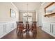 Cozy dining room with hardwood floors, decorative molding, and a charming chandelier at 1941 La Playa Dr., Myrtle Beach, SC 29588