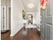Welcoming foyer features dark hardwood floors, neutral walls, decorative wainscoting, and attractive furnishings at 1941 La Playa Dr., Myrtle Beach, SC 29588