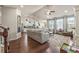 Spacious living room featuring hardwood floors, a ceiling fan, and ample natural light at 1941 La Playa Dr., Myrtle Beach, SC 29588