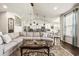 Stylish living room with a large sectional sofa, coffee table, and view of the kitchen at 1941 La Playa Dr., Myrtle Beach, SC 29588