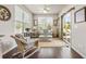 Charming sunroom with wicker furniture, natural light, and access to the outdoors at 1941 La Playa Dr., Myrtle Beach, SC 29588