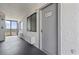 Hallway view with the entrance to unit 1309, featuring a window and balcony access at 2001 S Ocean Blvd. # 1309, Myrtle Beach, SC 29577