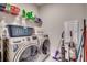 Modern laundry room equipped with front load washer and dryer at 2023 Singing Palm Loop, Little River, SC 29566