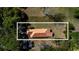 Bird's eye view of home's roof and the surrounding spacious, tree-filled property at 208 Prince St., Georgetown, SC 29440