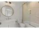 Elegant bathroom features a marble shower, ornate mirror, and vanity with gold fixtures at 212 78Th Ave. N, Myrtle Beach, SC 29572