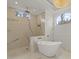 Elegant bathroom featuring a freestanding tub, rainfall shower head and marble accents at 212 78Th Ave. N, Myrtle Beach, SC 29572
