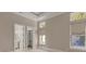 Bedroom with neutral walls, hardwood flooring, and access to the bathroom and closet at 212 78Th Ave. N, Myrtle Beach, SC 29572