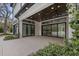 Covered patio boasts an outdoor ceiling fan and large glass doors leading inside at 212 78Th Ave. N, Myrtle Beach, SC 29572