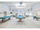 Clubhouse billiard room with a skylight and beautiful chandelier lighting at 212 Starlit Way, Myrtle Beach, SC 29579