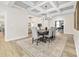 Open dining room showcasing a large table, six chairs, and modern decor in neutral tones, perfect for entertaining at 212 Starlit Way, Myrtle Beach, SC 29579