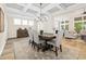Elegant dining room featuring coffered ceilings, a chandelier, stylish decor, and seamless flow to other rooms at 212 Starlit Way, Myrtle Beach, SC 29579