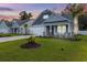 Charming two-story home with a manicured lawn and beautiful landscaping at 212 Starlit Way, Myrtle Beach, SC 29579