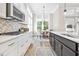 Bright kitchen featuring stainless appliances, white cabinets and a cozy breakfast nook at 212 Starlit Way, Myrtle Beach, SC 29579
