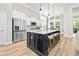 Well-equipped kitchen with a wine rack, stainless appliances, large island and breakfast nook at 212 Starlit Way, Myrtle Beach, SC 29579