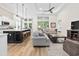 Bright open-concept area with a kitchen island, pendant lighting, and comfortable seating, seamlessly connected at 212 Starlit Way, Myrtle Beach, SC 29579