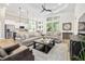 Spacious living room featuring high ceilings, large windows, and stylish furnishings throughout at 212 Starlit Way, Myrtle Beach, SC 29579