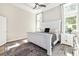 Inviting bedroom with a tray ceiling, soft lighting and large windows at 212 Starlit Way, Myrtle Beach, SC 29579