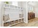 Charming mudroom with built-in bench, cubbies, and storage baskets for organization and style at 212 Starlit Way, Myrtle Beach, SC 29579
