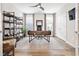 Bright office space features a modern desk, open shelving, and natural light, great for productivity at 212 Starlit Way, Myrtle Beach, SC 29579